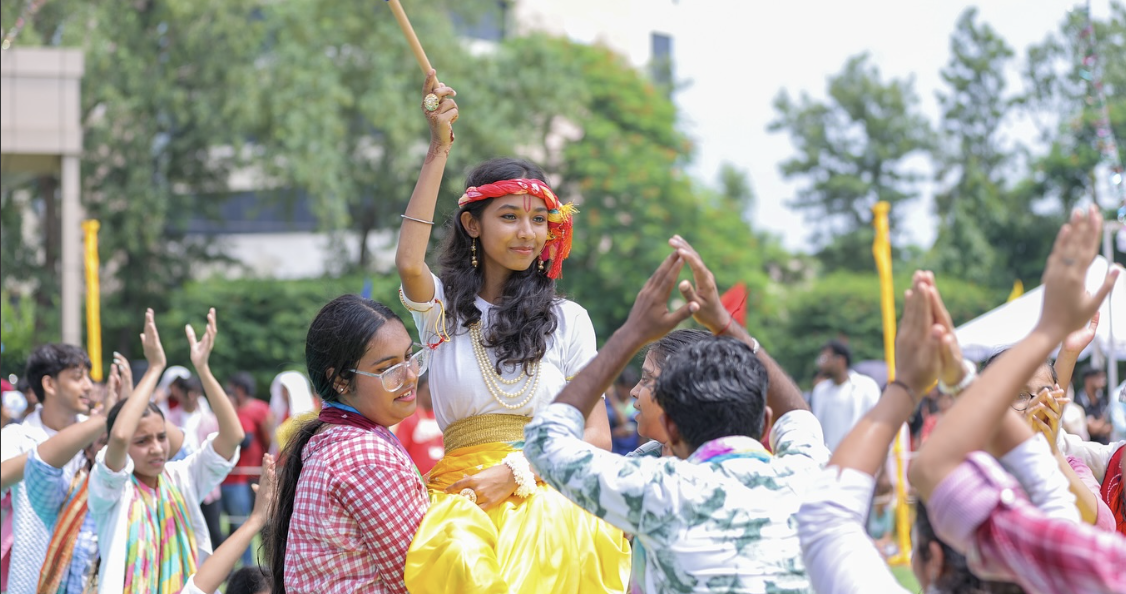 Students celebrating Janmashtami with Matki Phod competition at SGT University.