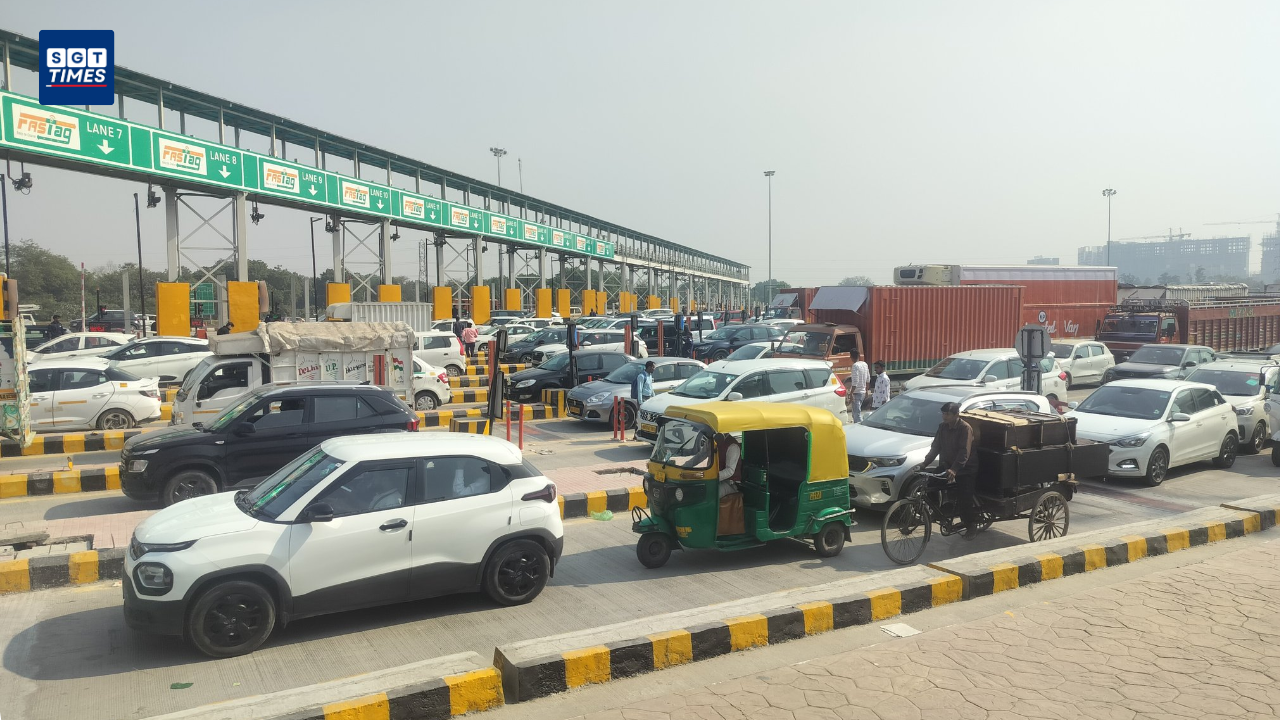 Cars moving on Dwarka Expressway as NHAI prepares toll collection at Bijwasan Plaza.