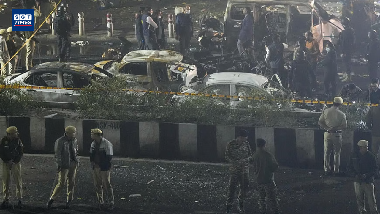Scene of Red Fort metro blast with damaged vehicles and rescue teams at the site.