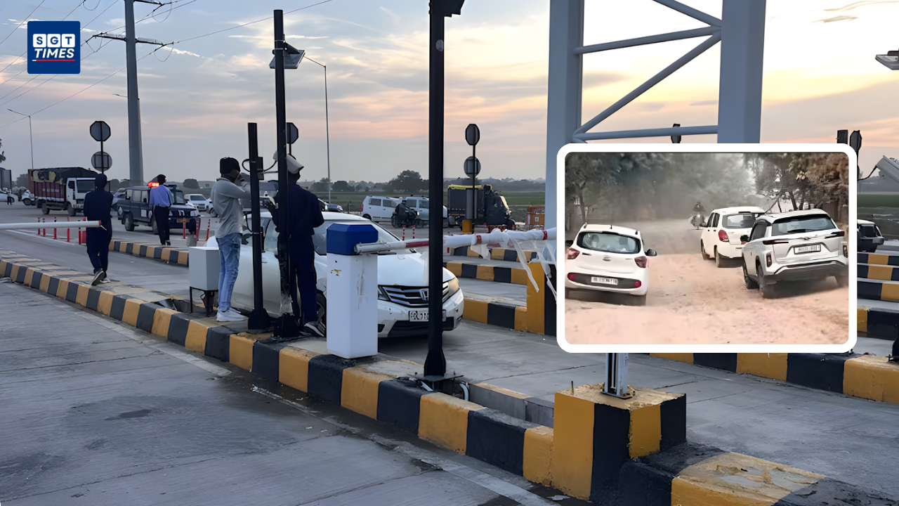 Commuters driving on crater-filled Raghopur Road near Dwarka Expressway
