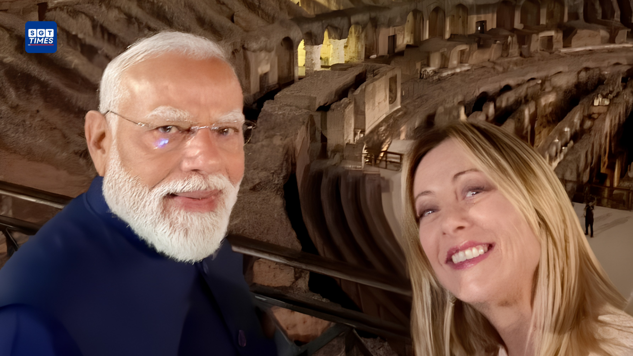 PM Modi, Giorgia Meloni Meet In Rome PM Narendra Modi and Italian PM Giorgia Meloni posing together near the illuminated Colosseum in Rome.