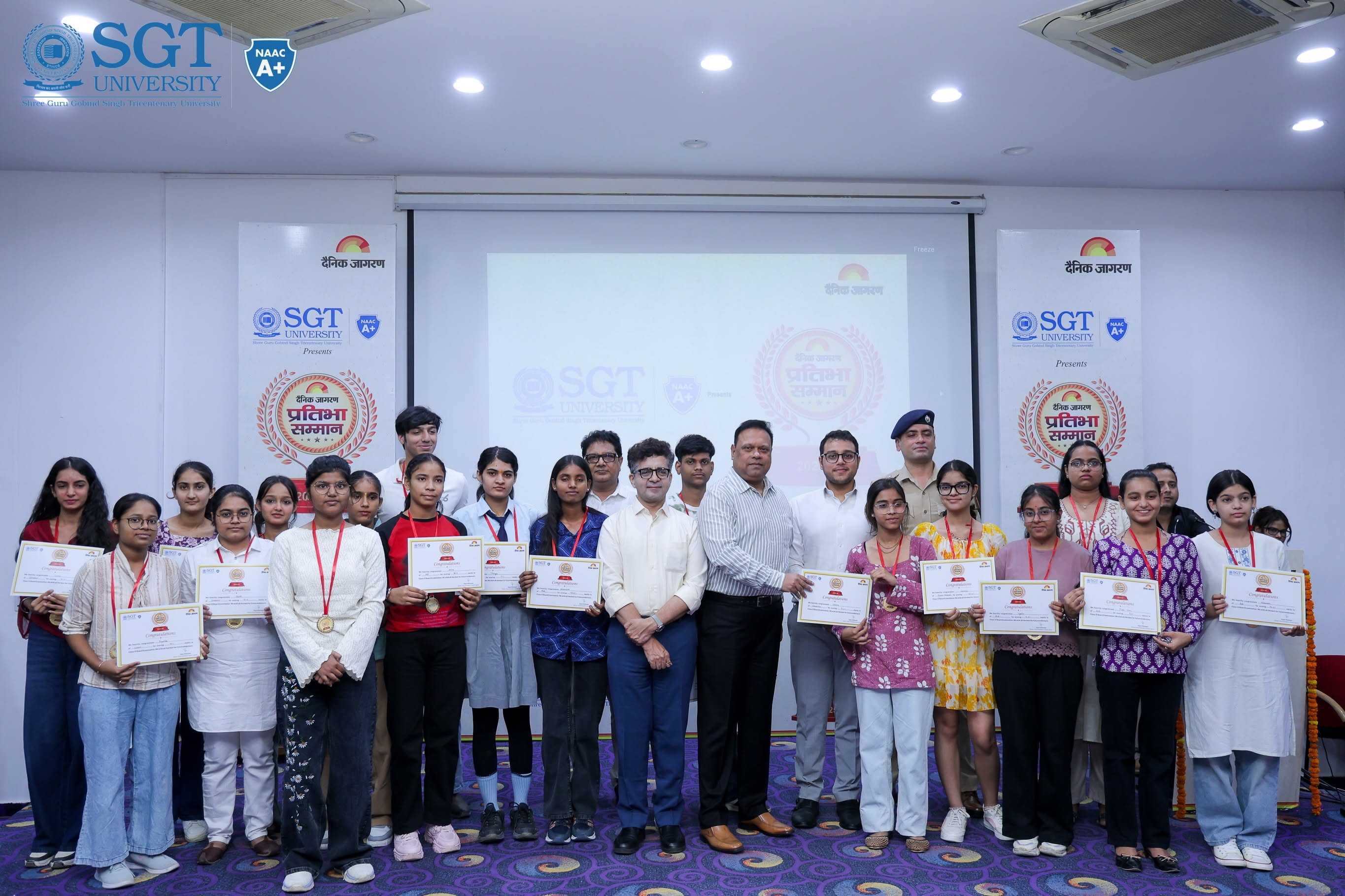 Class 12 meritorious students receiving medals and certificates during Dainik Jagran Pratibha Samman 2026 at SGT University, Gurugram.