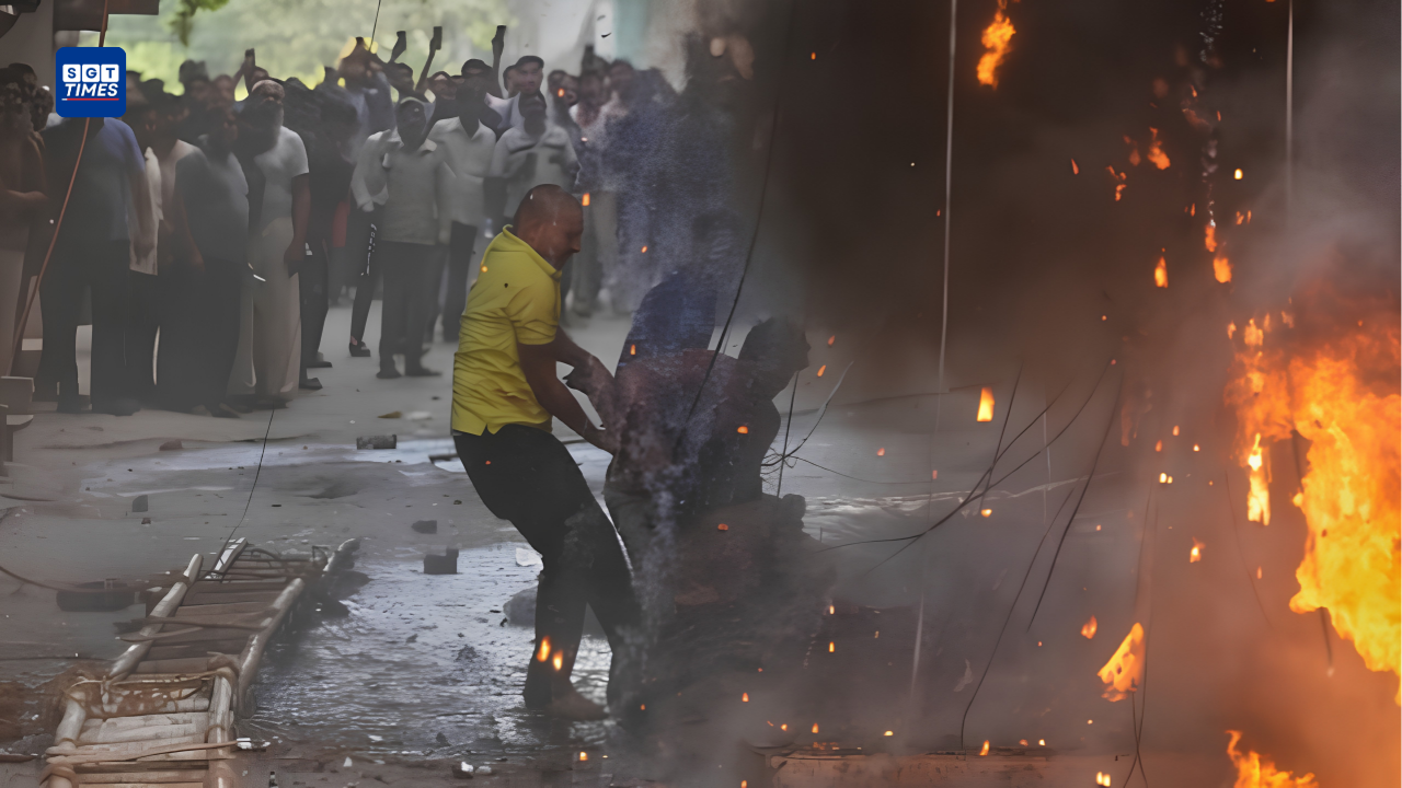 Firefighters conducting rescue operations outside a burning hotel building in Delhi’s Malviya Nagar area.