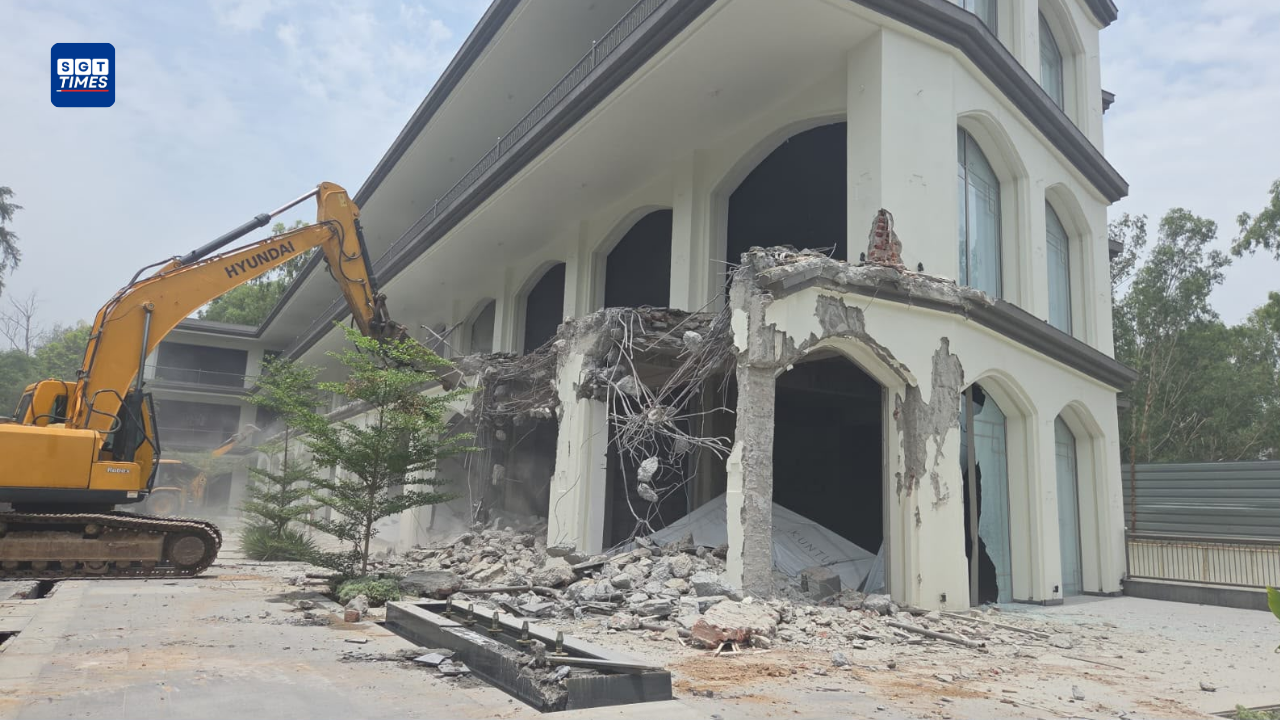 Bulldozers and police teams demolishing illegal constructions in Delhi
