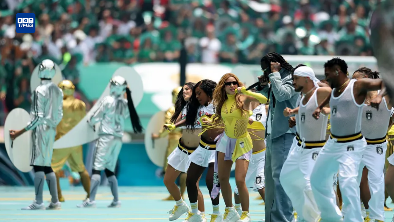 Shakira in a vibrant outfit and Burna Boy performing together on a colorful stage during the FIFA World Cup 2026 opening ceremony in Mexico City.