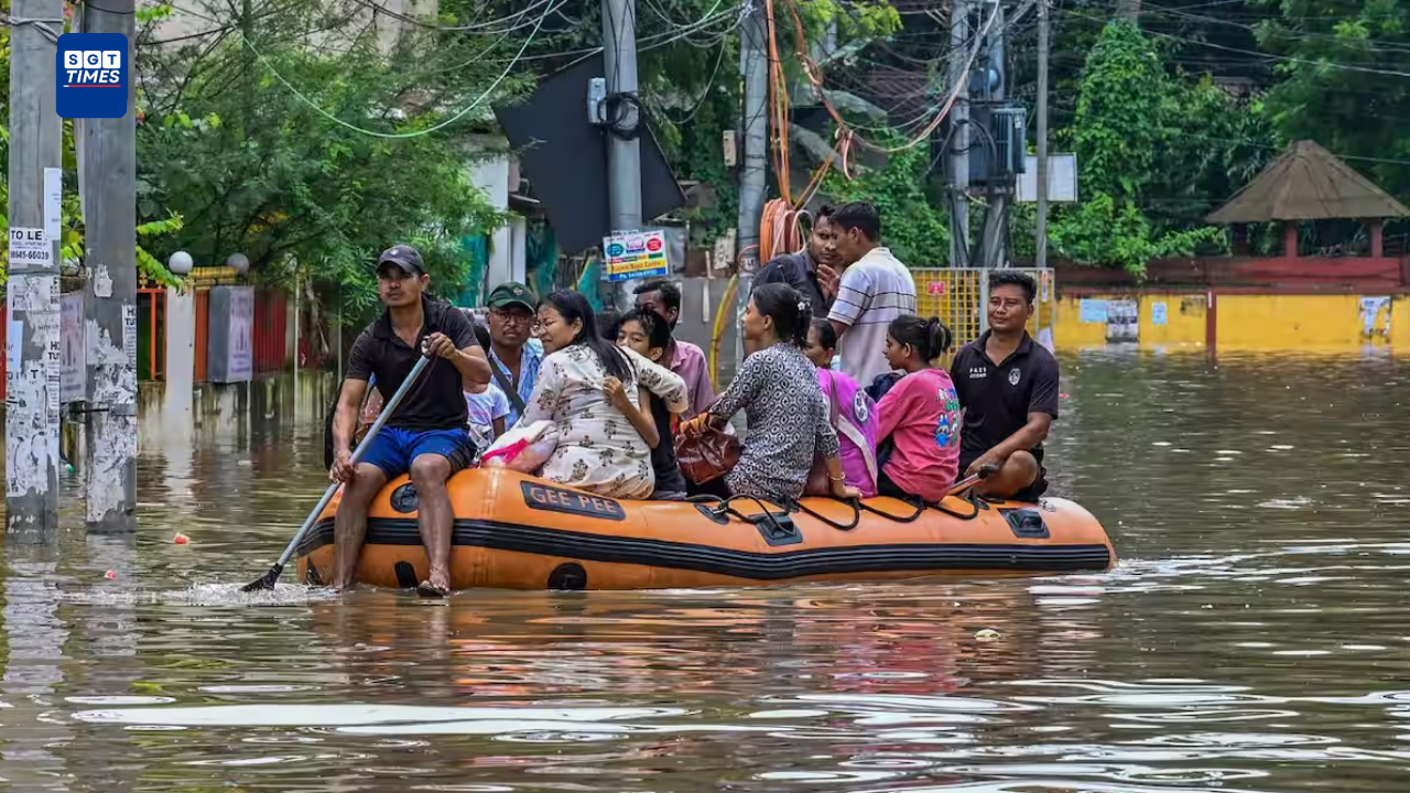 Assam Flood Death Toll Reaches 95 as 14 Districts Remain on High Alert Flood-affected homes and submerged roads in Assam as rescue teams evacuate residents following heavy monsoon rainfall.
