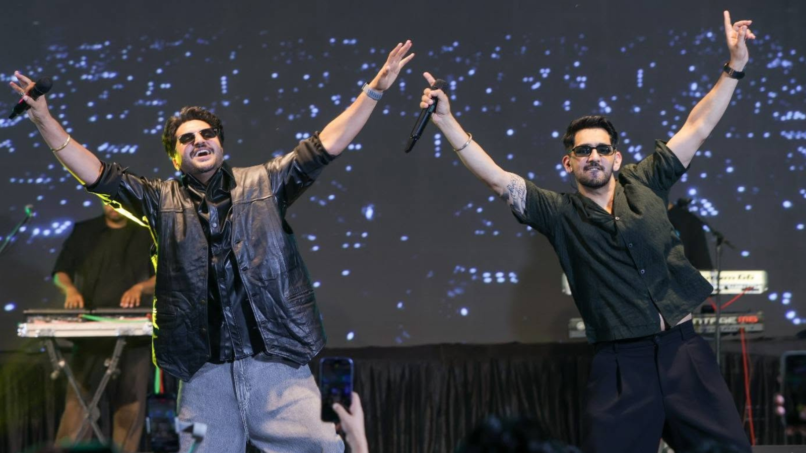 Jassie Gill and Babbal Rai Electrify SGT University with Live Concert Punjabi singers Jassie Gill and Babbal Rai performing live on stage at SGT University as an enthusiastic student crowd cheers and sings along.